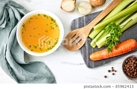 bowl of fresh chicken broth bowl of fresh chicken broth 85962413