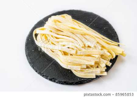 Raw pasta noodles Raw pasta noodles 85965853