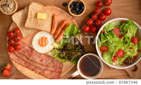 Healthy breakfast meal with salad bowl, black coffee. top view 85967346