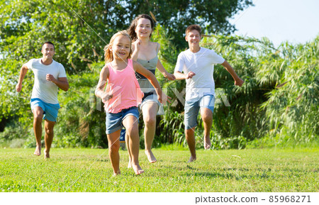 Cheerful family running 85968271