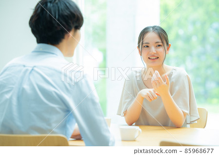 A couple talking in the living room 85968677