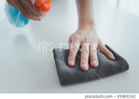 Woman cleaning her house. Woman cleaning her house. 85969142