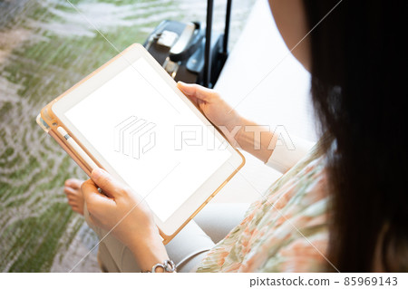 Woman using tablet. Woman using tablet. 85969143