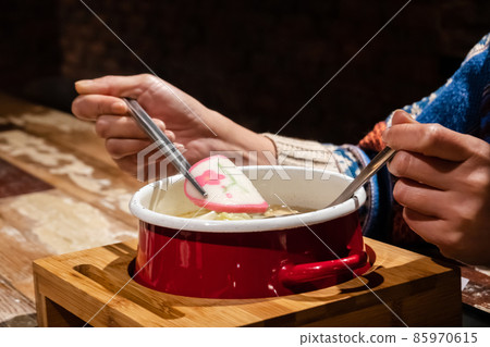 woman eating hot pot 85970615