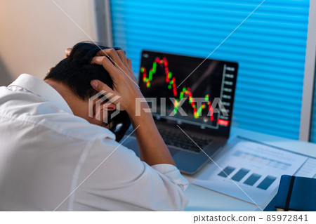 Overwork Concept The male who works in the office holding his head with stressful emotion 85972841