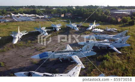 Aerial drone view flight over old rusty broken plane aircraft. 85973058