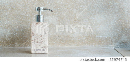 Toiletries bottles in bathroom at luxury hotel or modern home. body shower gel in ceramic ware with wall background 85974743
