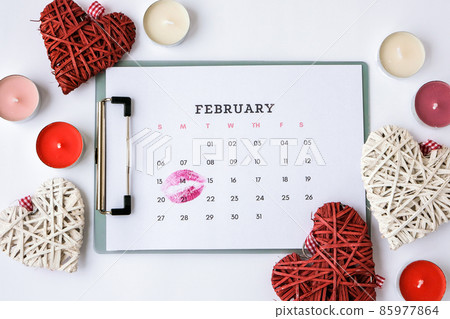 Calendar with 14th of February date. Planning Valentines day holiday. Love romantic dating. Preparing with hearts. Calendar with 14th of February date. Planning Valentines day holiday. Love romantic dating. Preparing with hearts. 85977864