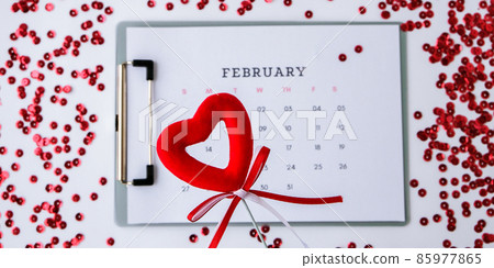 Calendar with 14th of February date. Planning Valentines day holiday. Love romantic dating. Preparing with hearts. Calendar with 14th of February date. Planning Valentines day holiday. Love romantic dating. Preparing with hearts. 85977865