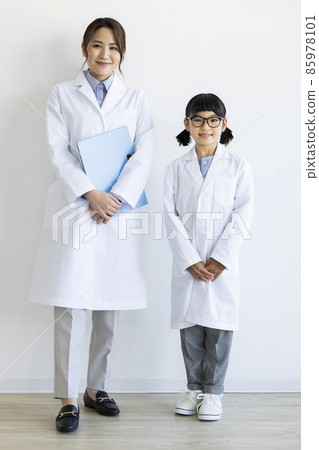Women and girls in lab coats Women and girls in lab coats 85978101