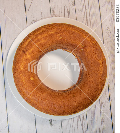 Pastry, Traditional Italian rum cake with whipped cream and raspberries 85978288