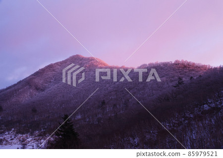 Mt. Akagi in the midwinter illuminated by the morning sun Mt. Akagi in the midwinter illuminated by the morning sun 85979521