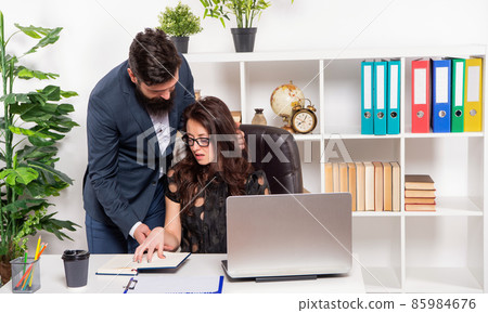 Man boss touching and harassing office manager at workplace, harassment Man boss touching and harassing office manager at workplace, harassment 85984676