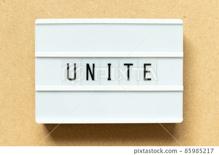 Lightbox with word unite on wood background Lightbox with word unite on wood background 85985217