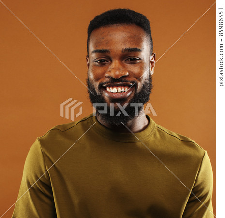 young pretty african american man posing cheerful on brown background, lifestyle people concept young pretty african american man posing cheerful on brown background, lifestyle people concept 85986551