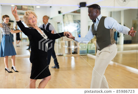 Two professional dancers practicing lindy hop in dance class 85986723