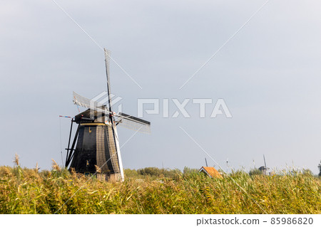 Horizontal picture of one of the famous Dutch windmills at Kinderdijk, a UNESCO world heritage site Horizontal picture of one of the famous Dutch windmills at Kinderdijk, a UNESCO world heritage site 85986820