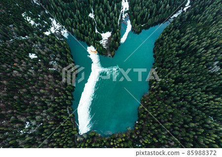 Lake Synevyr in the Carpathians of Ukraine, the lake was taken from a drone, the view of the lake from above. Lake Synevyr in the Carpathians of Ukraine, the lake was taken from a drone, the view of the lake from above. 85988372