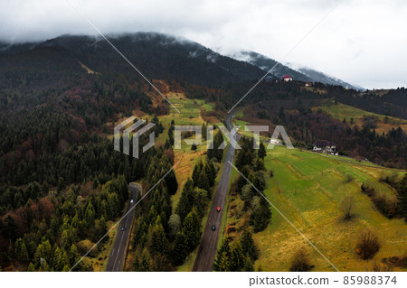 Ukrainian roads in the mountains, serpentines from roads and forests, views of the mountains and the road. 85988374