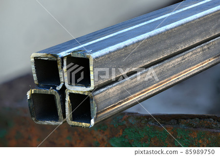 Metal profile pipe cutting. Cut metal pipe with a grinder. 85989750