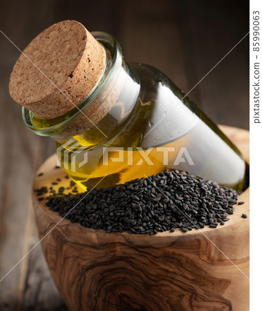 Black sesame and bottle with oil. Black sesame and bottle with oil. 85990063