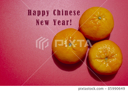 Concept image of the chinese new year - Mandarin orange on red background 85990649