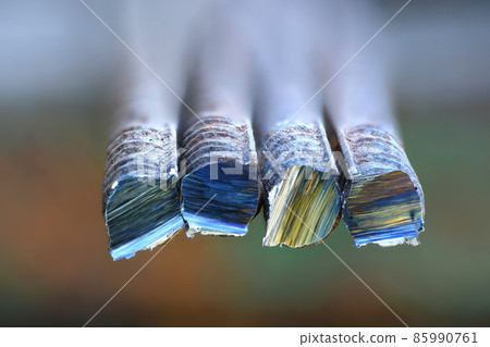 Metal bar cutting. A metal bar cut by a grinder. Metal bar cutting. A metal bar cut by a grinder. 85990761