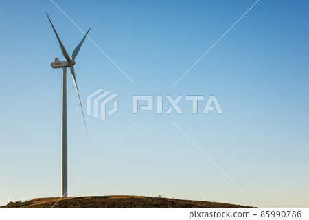 Turbines in a mountain wind farm. Ecological energy production. 85990786