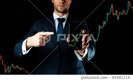 Business graph. Businessman holding finance application for sell, buy and analysis profit dividend statistics. Investment business technology app on digital screen. Shares stockmarket background. 85991214