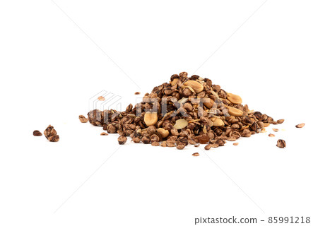 A bunch of muesli with chocolate and almonds on a white background. A bunch of muesli with chocolate and almonds on a white background. 85991218