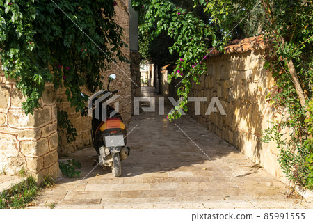 scooter parked on a narrow historical street in a mediterranean city scooter parked on a narrow historical street in a mediterranean city 85991555