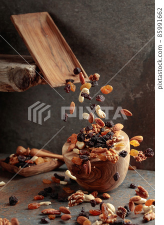 Falling dish with nuts and raisins. Falling dish with nuts and raisins. 85991662