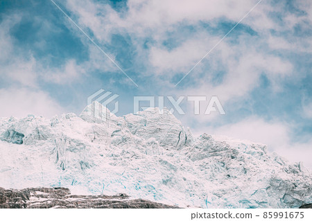 Jostedalsbreen National Park, Norway. Close Up View Of Melting Ice And Snow On Boyabreen Glacier In Summer Sunny Day. Famous Norwegian Landmark And Popular Destination. Close Up Jostedalsbreen National Park, Norway. Close Up View Of Melting Ice And Snow On Boyabreen Glacier In Summer Sunny Day. Famous Norwegian Landmark And Popular Destination. Close Up 85991675