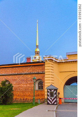 Watercolor drawing of Golden spire of Saints Peter and Paul Cathedral church over brick wall 85991862