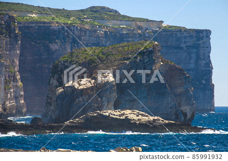 Watercolor drawing of Amazing Fungus and Gebla Rock cliffs with Rocky coastline in the Dwejra Bay beach near collapsed Azure window 85991932