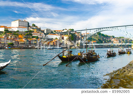 Watercolor drawing of colorful houses of old town Porto, wooden boats on Douro river close up, Porto old town view, a group of boats sailing 85992005