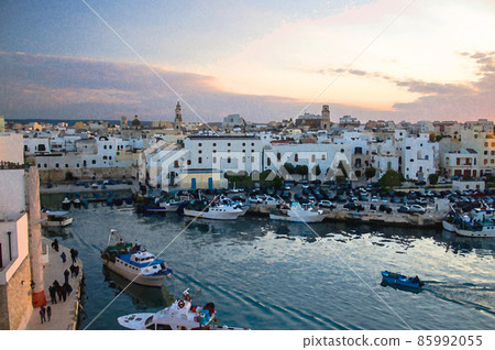 Watercolor drawing of boats in bay harbour of a seaside town Monopoli view from Castle of Carlo V, Puglia Apulia Watercolor drawing of boats in bay harbour of a seaside town Monopoli view from Castle of Carlo V, Puglia Apulia 85992055