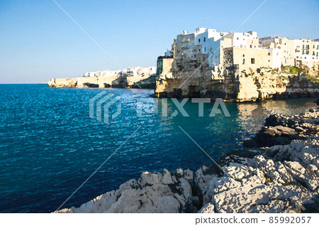 Watercolor drawing of Polignano a mare town with white buildings on grottos and cliffs in Puglia Apulia Watercolor drawing of Polignano a mare town with white buildings on grottos and cliffs in Puglia Apulia 85992057