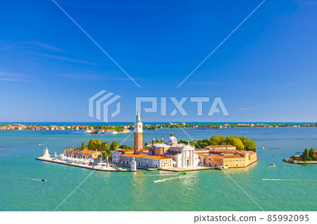 Watercolor drawing of Aerial panoramic view of San Giorgio Maggiore island with Campanile San Giorgio in Venetian Lagoon, sailing boats in Giudecca Canal Watercolor drawing of Aerial panoramic view of San Giorgio Maggiore island with Campanile San Giorgio in Venetian Lagoon, sailing boats in Giudecca Canal 85992095