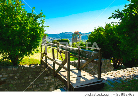 Watercolor drawing of Old Clock tower chapel, wooden bridge, trees and ruins of Stari Bar fortress Watercolor drawing of Old Clock tower chapel, wooden bridge, trees and ruins of Stari Bar fortress 85992462