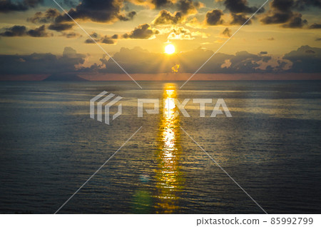 Watercolor drawing of Aerial view of beautiful amazing sea sunset, seascape and endless horizon with color dramatic sky with clouds and volcano hill mountain island Stromboli Watercolor drawing of Aerial view of beautiful amazing sea sunset, seascape and endless horizon with color dramatic sky with clouds and volcano hill mountain island Stromboli 85992799