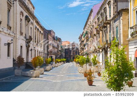 Watercolor drawing of Via Teatro Massimo street with green plants trees leads to Massimo Bellini Opera House in Catania 85992809