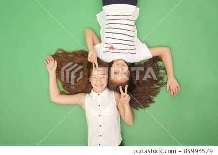 Portrait of two young girls with long hair, top view 85993579