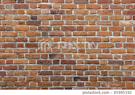 Natural old vintage weathered red brown solid brick wall. Abstract copy space background. Natural old vintage weathered red brown solid brick wall. Abstract copy space background. 85995192