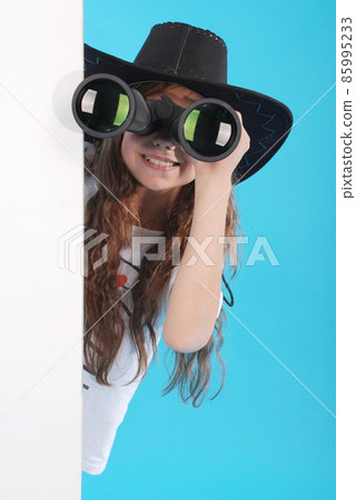 Young girl with binoculars 85995233