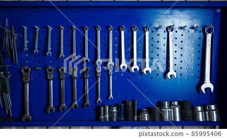 A mechanic's set of screwdrivers hangs on the wall. A mechanic's set of screwdrivers hangs on the wall. 85995406