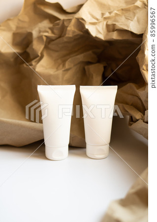 White tube of cream mock-up, design ready cosmetic and care product packaging White tube of cream mock-up, design ready cosmetic and care product packaging 85996567