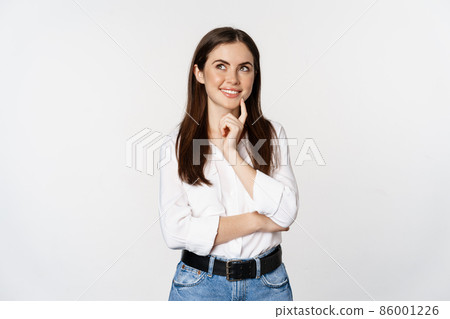 Portrait of female entrepreneur thinking, making choice, standing thoughtful, white studio background Portrait of female entrepreneur thinking, making choice, standing thoughtful, white studio background 86001226
