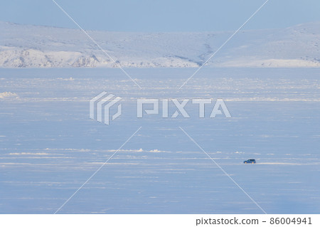 The car is driving on snow and ice The car is driving on snow and ice 86004941