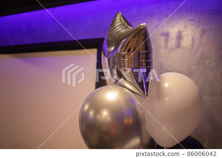 Close-up of balloons in the shape of heart Helium balloons. Gold and silver. Close-up of balloons in the shape of heart Helium balloons. Gold and silver. 86006042